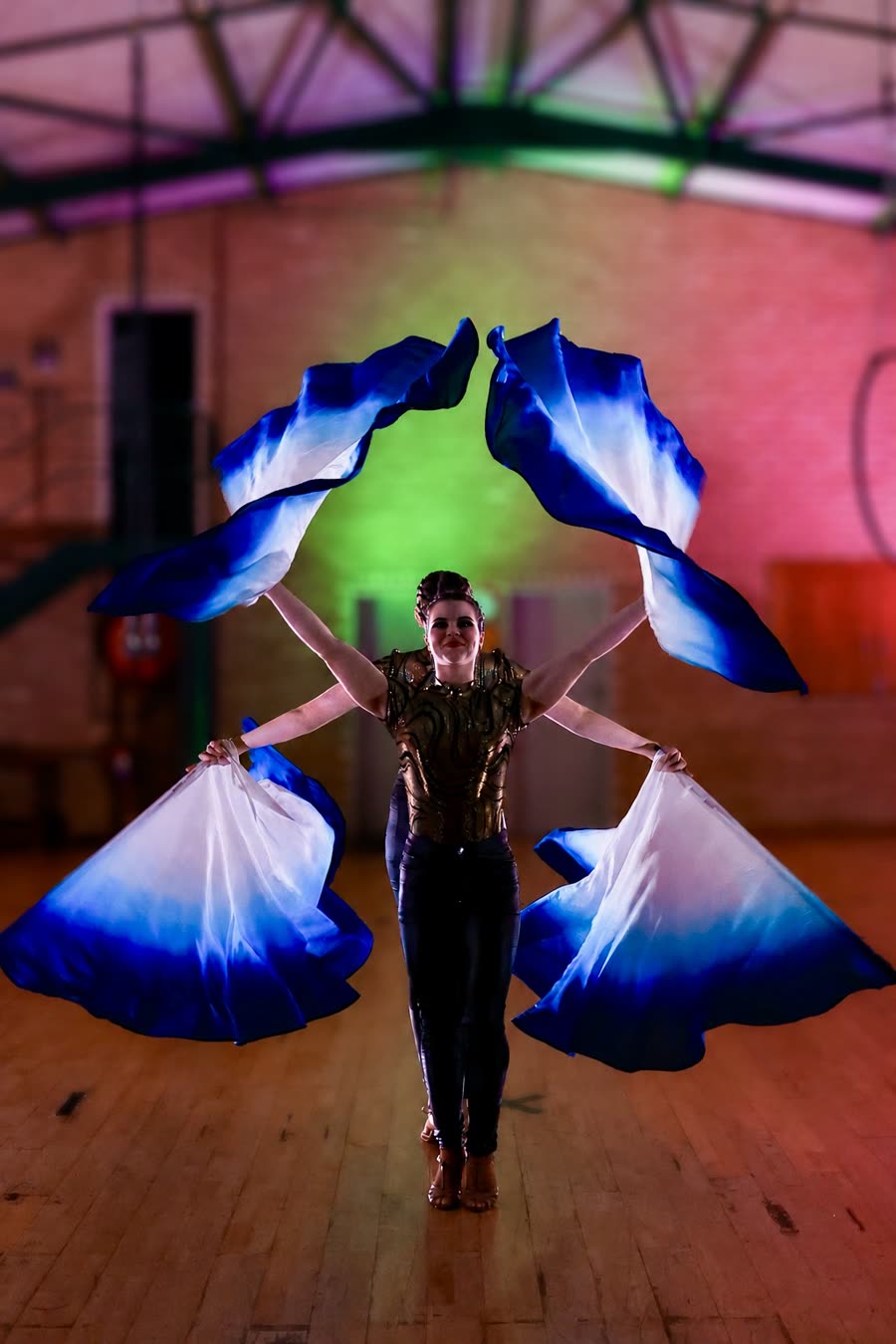 LED flag dance performance at an indoor corporate event